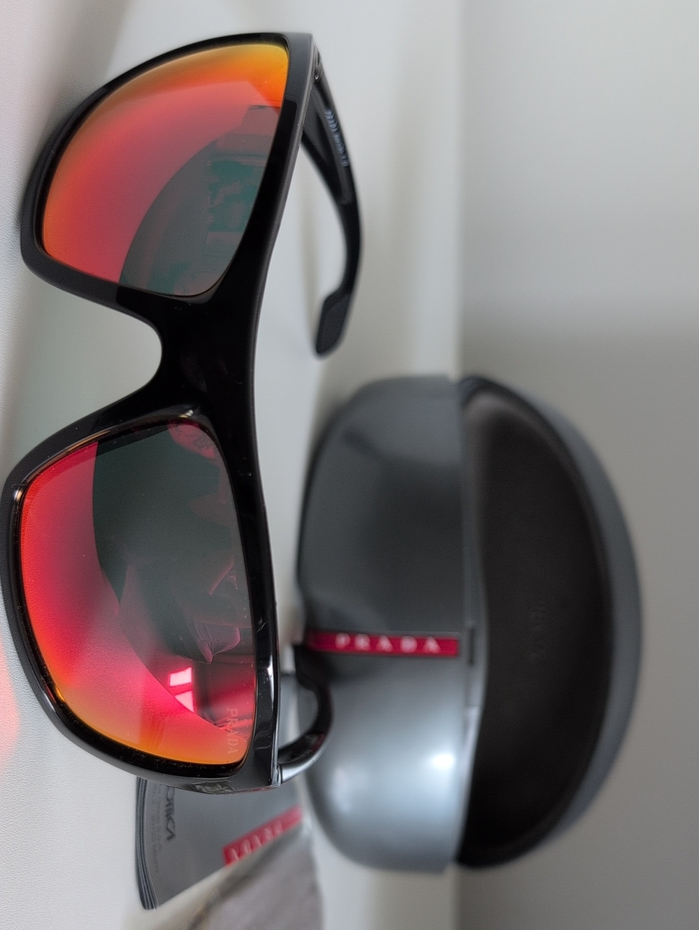 Prada Black Sunglasses with Red-Orange Mirrored Lenses